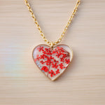 Woman heart pendant necklace with real red flowers in resin. Steel chain. Minimalist jewelry botany terrarium nature