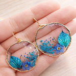 Orecchini fiori blu cerchi pendenti leggeri donna ciondolo fiori veri resina.Gioielli resina fiori secchi pressati.Regalo unico per lei