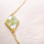 Terrarium woman bracelet real flower four-leaf clover lucky charm Resin pendant adjustable steel chain one size.Resin jewels