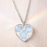 Real flowers heart necklace Forget me not in uv resin. Silver forget-me-not heart pendant. Resin jewelry. Dried pressed flowers
