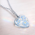 Real flowers heart necklace Forget me not in uv resin. Silver forget-me-not heart pendant. Resin jewelry. Dried pressed flowers