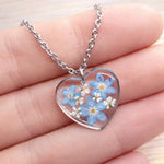 Real flowers heart necklace Forget me not in uv resin. Silver forget-me-not heart pendant. Resin jewelry. Dried pressed flowers