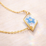 Braccialetto terrarium fiore vero forget me not azzurro Ciondolo resina catenella acciaio regolabile taglia unica.Gioielli resina fiori