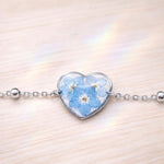 Bracciale donna cuore terrarium fiori veri forget me not azzurri Ciondolo resina catenella acciaio regolabile taglia unica.Gioielli resina
