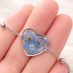 Bracciale donna cuore terrarium fiori veri forget me not azzurri Ciondolo resina catenella acciaio regolabile taglia unica.Gioielli resina