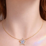 Collana con fiore vero forget me not/nontiscordardimé, pendente a stella, resina UV, catena in acciaio placcato oro, stile botanico/boho