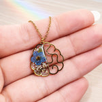 Handmade necklace with anatomical brain pendant in steel and real flowers.Resin jewelry.Gift for doctors.Gift for psychologists,neurologists