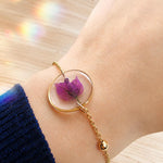 Bracciale donna oro fiore vero bouganville in resina. Ciondolo resina catenella acciaio oro regolabile taglia unica.Gioielli resina fiori