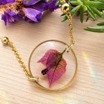Bracciale donna oro fiore vero bouganville in resina. Ciondolo resina catenella acciaio oro regolabile taglia unica.Gioielli resina fiori